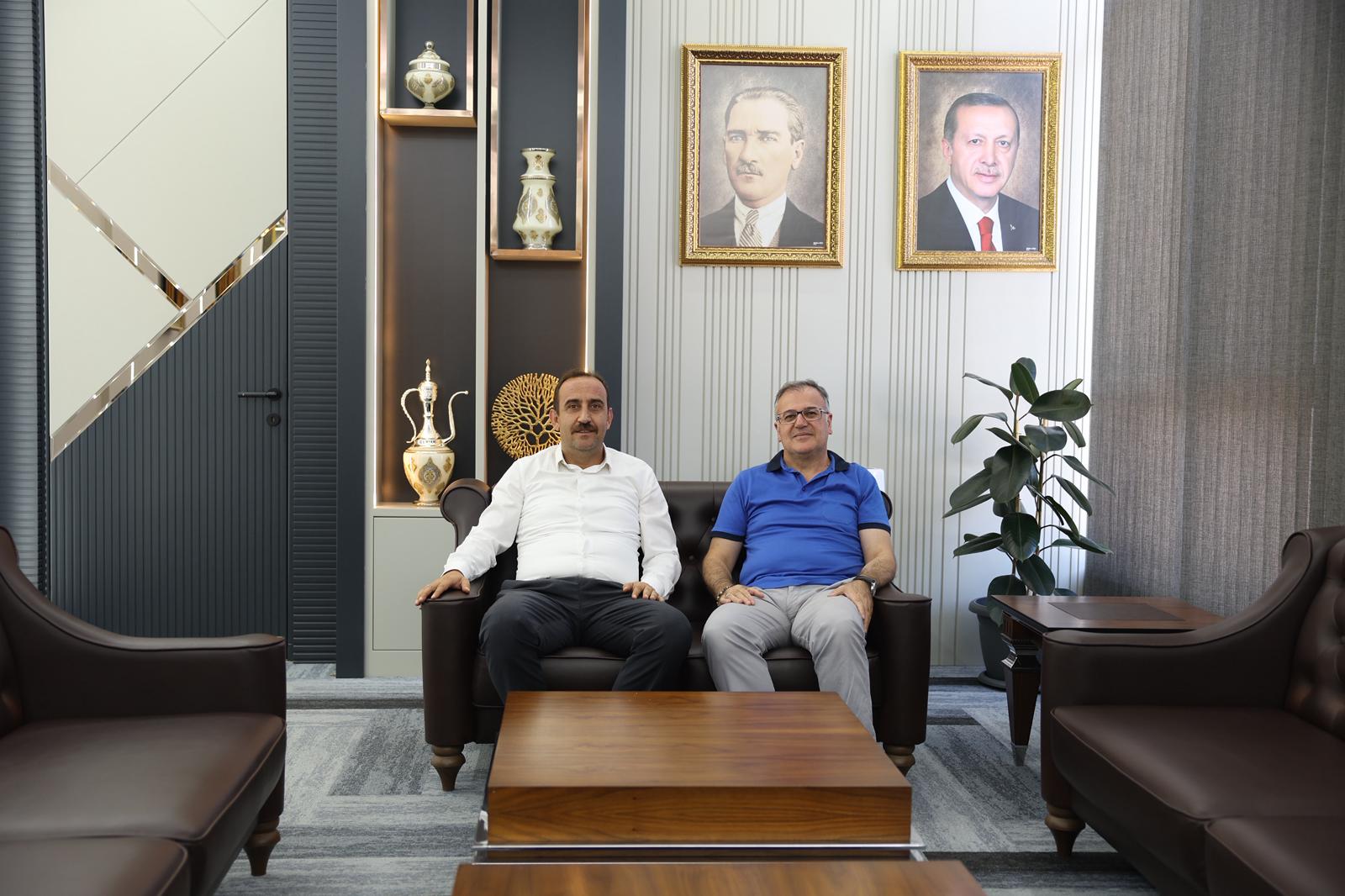 Başkan İlmek'ten Hacılar Belediyesi'ne Ziyaret: Yerel Yönetim İş Birliği Vurgusu